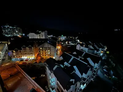 a view of a city at night with buildings at Stoberi CekelatHomestay in Brinchang