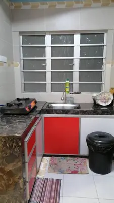 a kitchen with a sink and a counter top at Stoberi CekelatHomestay in Brinchang