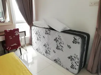 a suitcase sitting in a room next to a window at Exclusive Studio/15th/ 1~4pax/ Gurney/ Mansion One in George Town