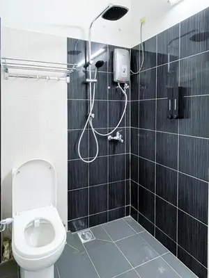 a bathroom with a toilet and a shower at Lake View 53 Heritage 4BR by LOUIS in Taiping