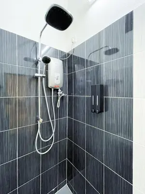 a bathroom with a shower with a shower head at Lake View 53 Heritage 4BR by LOUIS in Taiping