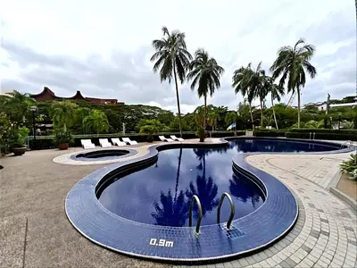 a swimming pool with two swans in the water at Sri Sayang Home Stay in George Town
