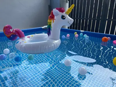 a plastic toy unicorn in a pool of water at NEW 20PX 5BR V KTV & JACUZZI SPA & POOL TABLE at TOWN CENTER & USM - kids pool no more in Gelugor
