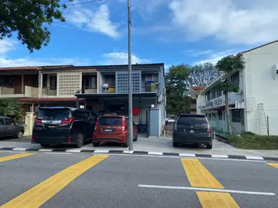 a parking lot with cars parked in front of a building at NEW 20PX 5BR V KTV & JACUZZI SPA & POOL TABLE at TOWN CENTER & USM - kids pool no more in Gelugor