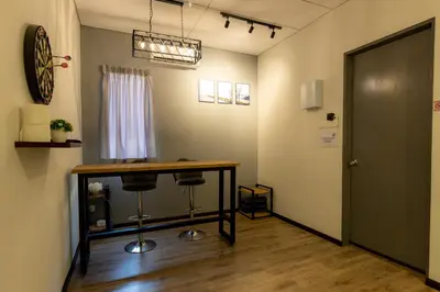a room with a table and two bar stools at 15Px 5BR V Jaccuzi Spa n KTV n Pool Table At Georgetown, USM n Lam Wah Ee Hospital -Kids pool no more in Gelugor