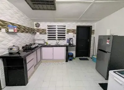 a kitchen with a black refrigerator and a white tile floor at Homestay Idaman Private Pool Mslim in Kuala Kangsar