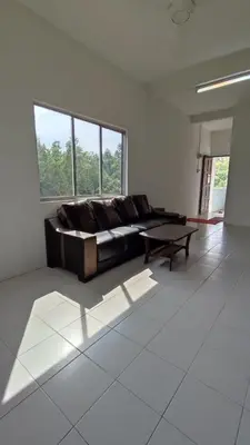 a living room with a couch and a coffee table at Pusing Holiday Apartment in Pusing