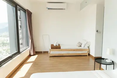 a bedroom with a bed and a large window at The CEDAR, 2BR Cityview by WStay @ Tropicana 218 Macalister in George Town