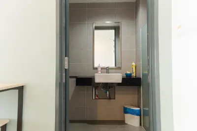 a bathroom with a sink and a mirror at The WILLOW, Studio Cityview by WStay @ Tropicana 218 Macalister in George Town
