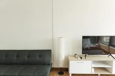 a living room with a couch and a tv at The WILLOW, Studio Cityview by WStay @ Tropicana 218 Macalister in George Town