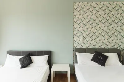 two beds sitting next to each other in a bedroom at The WILLOW, Studio Cityview by WStay @ Tropicana 218 Macalister in George Town