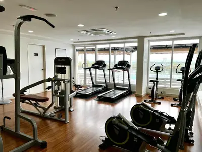 a gym with several treadmills and elliptical machines at High floor Mountain view Kampar in Kampar