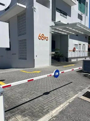 a street barrier in front of a building at Sunrise@Gurney Spacious 2BR Duplex in George Town
