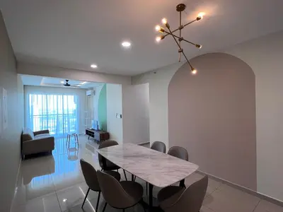 a dining room with a table and chairs at METROPOL SERVICED APARTMENT at Bukit Mertajam, Pulau Pinang in Bukit Mertajam