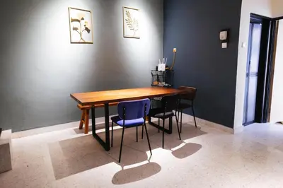 a dining room table and chairs in a room at monstera homestay near Tambun, Ipoh Garden East in Ipoh