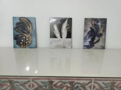 four pictures of birds on a white wall at Sweet 3 bedroom home @ Canning Garden, Ipoh in Ipoh