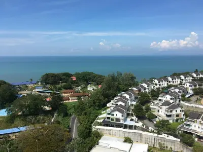 an aerial view of a city with houses and the ocean at The Ferringhi Sea View 777 in Batu Ferringhi