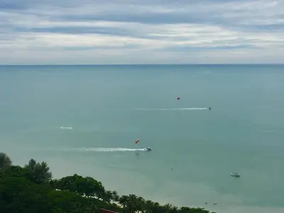 a large body of water with boats in it at The Ferringhi Sea View 777 in Batu Ferringhi