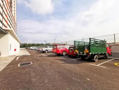 a group of cars parked in a parking lot at Starlight Homestay The Venus Sitiawan in Seri Manjung