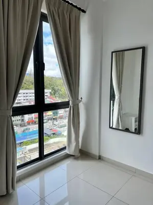 a room with a large window and a mirror at Lily Ville in Tanah Rata
