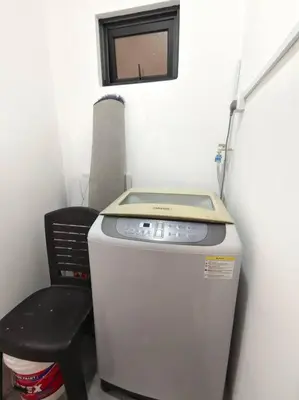 a small refrigerator and a black chair in a room at 【NEW】Cozy&Warm Studio@Juru Sentral Icon City in Bukit Mertajam