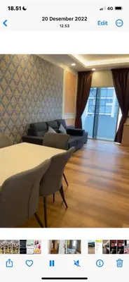 a living room with a couch and a table and chairs at Cameron Homestay klasik Adik Aisyah in Cameron Highlands