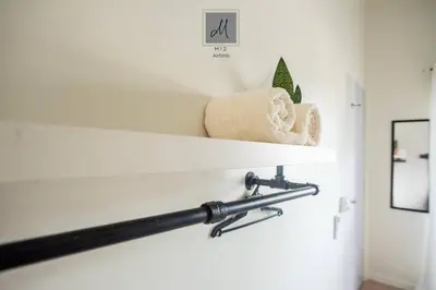 a shelf in a bathroom with towels on it at M12 Homestay, Butterworth in Butterworth