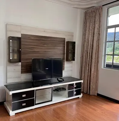 a living room with a flat screen tv at Cameron Crown Imperial Court @ Brinchang in Brinchang