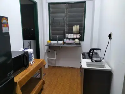 a small room with a sink and a window at KHAIRUL HOMESTAY PANGSAPURI SUTERA SEBERANG JAYA in Kampong Telok
