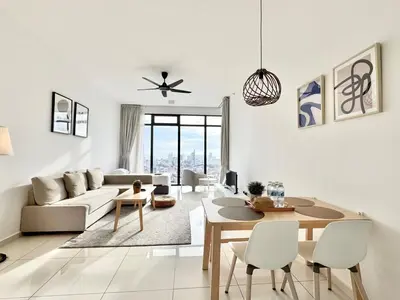 a living room with a couch and a table at Beacon Executive Suites #Warmth #SkyPool #Georgetown #5pax #2BR 2bath #2Queen 1Single #Quality well maintained #Private host in George Town