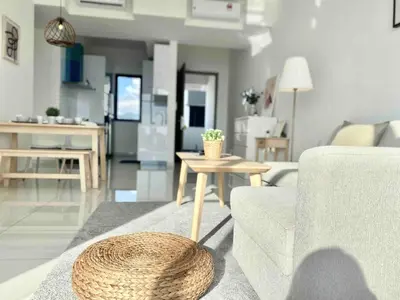 a living room with a couch and a table at Beacon Executive Suites #Warmth #SkyPool #Georgetown #5pax #2BR 2bath #2Queen 1Single #Quality well maintained #Private host in George Town