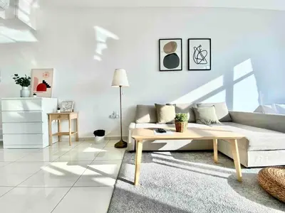 a living room with a couch and a coffee table at Beacon Executive Suites #Warmth #SkyPool #Georgetown #5pax #2BR 2bath #2Queen 1Single #Quality well maintained #Private host in George Town