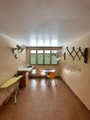 a kitchen and dining room with a table and chairs at Popus Heritage Townhouse, Georgetown in George Town