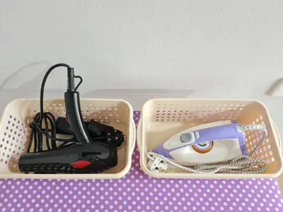 two plastic containers filled with tools on a table at Air-home M9 Simpang near Aulong Econsave, 4BR, 10pax, Netflix in Taiping