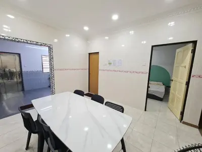 a room with a table and chairs and a mirror at Air-home M9 Simpang near Aulong Econsave, 4BR, 10pax, Netflix in Taiping