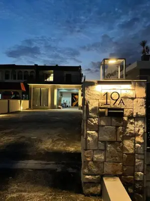 a building with a sign on the side of it at 5000 SQFT BRAND NEW Semi-D Hype Home 10pax in Ipoh