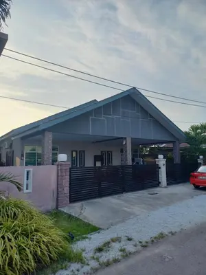 a house with a car parked in front of it at Yaths homestay in Butterworth