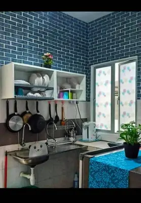 a kitchen with a sink and a counter top at Amrich Staycation Muslim Cameron Highlands in Tanah Rata