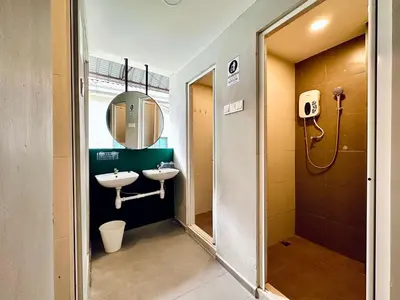 a bathroom with two sinks and a mirror at Armenian Guest House by LOLZ for 22pax in George Town