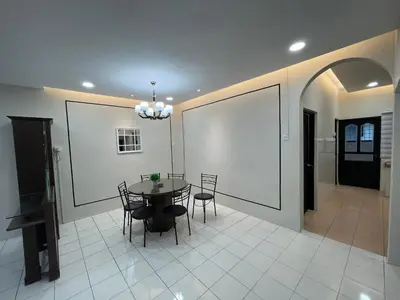 a dining room with a table and chairs at Ipoh 42 Symphony 12pax 4Bedroom 3bathroom 3carpark in Ipoh