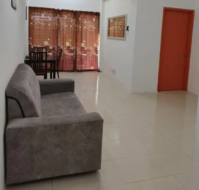 a living room with a couch and a table at Homestay Lumut Perak 2026 in Lumut
