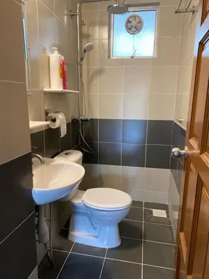 a bathroom with a toilet and a sink at Jo’s Place Cameron Highlands EA922 in Brinchang
