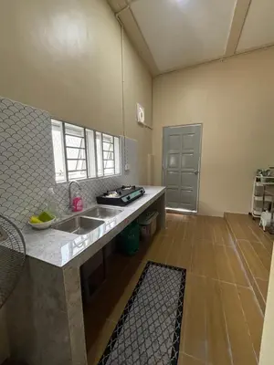 a kitchen with a sink and a counter top at Homestay Bota Sunrise in Kampung Bota Kiri