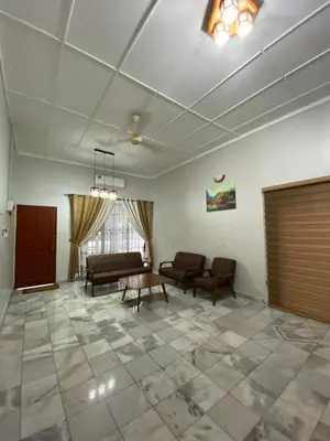 a large living room with couches and a table at Nur Kasih Homestay Seri Manjung in Seri Manjung