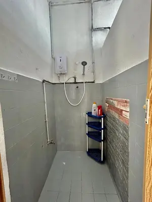 a bathroom with a shower and a tiled floor at Cozy18#4pax#NearAeonAlma,Mcd#2kmtoIconic in Bukit Mertajam