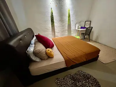 a bedroom with a bed with a teddy bear on it at Cozy33#4pax#Wifi#NearAeonAlma#20minstobatukawan in Bukit Mertajam