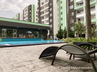 a swimming pool in a building with two benches at Manhattan Condo Ipoh Waterpark PoolView FREE Carpark & Netflix by PLY Home in Ipoh