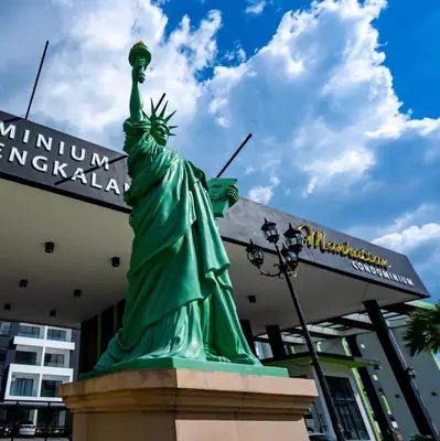 the statue of liberty in front of a building at Manhattan Condo Ipoh Waterpark PoolView FREE Carpark & Netflix by PLY Home in Ipoh