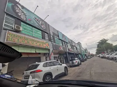 a white car parked in front of a building at Bdr Seri Botani ipoh-nordic (tvbox/mahjong 19pax) in Ipoh