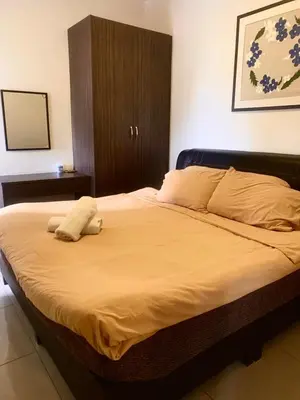 a large bed with two pillows on top of it at Paddy Bee in Brinchang